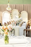 a table with a vase of flowers on top of it