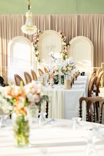 a table with a vase of flowers on top of it