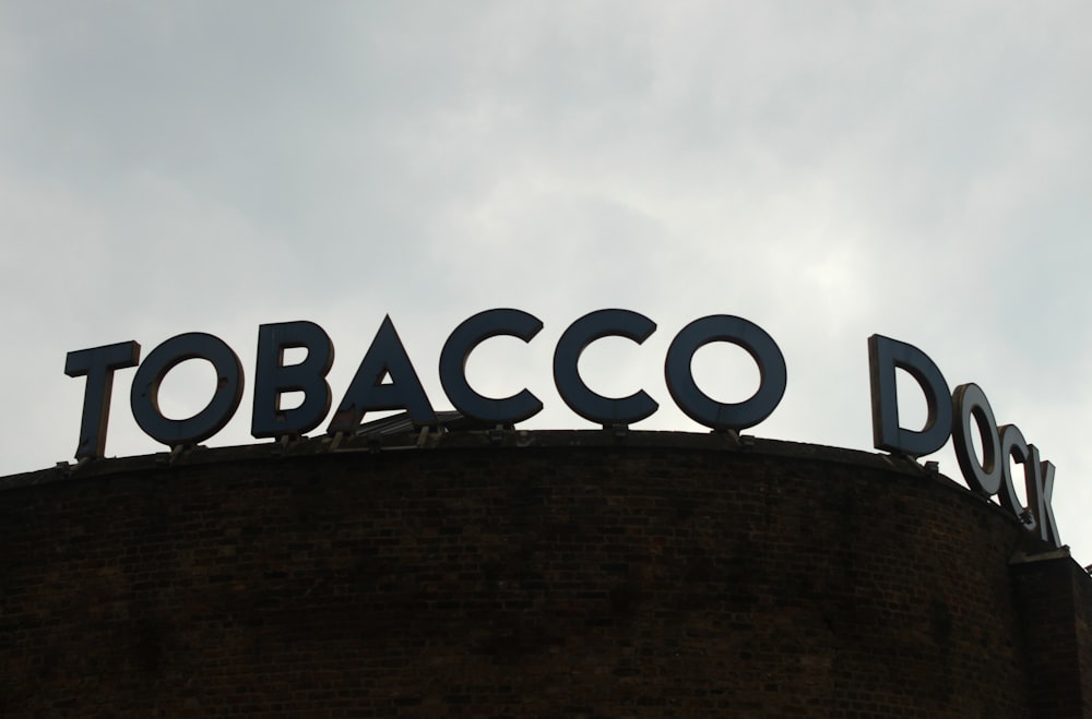 a sign on top of a brick building