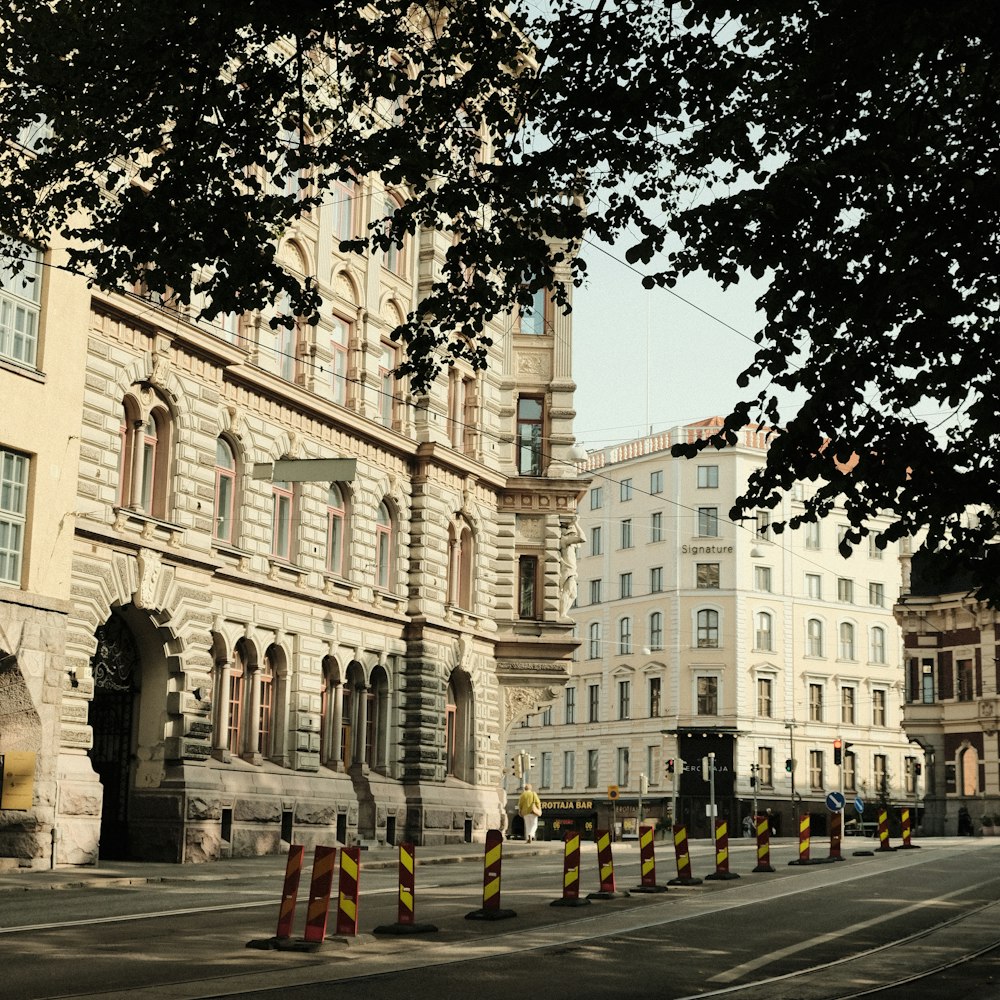 a city street with traffic cones on the side of the road