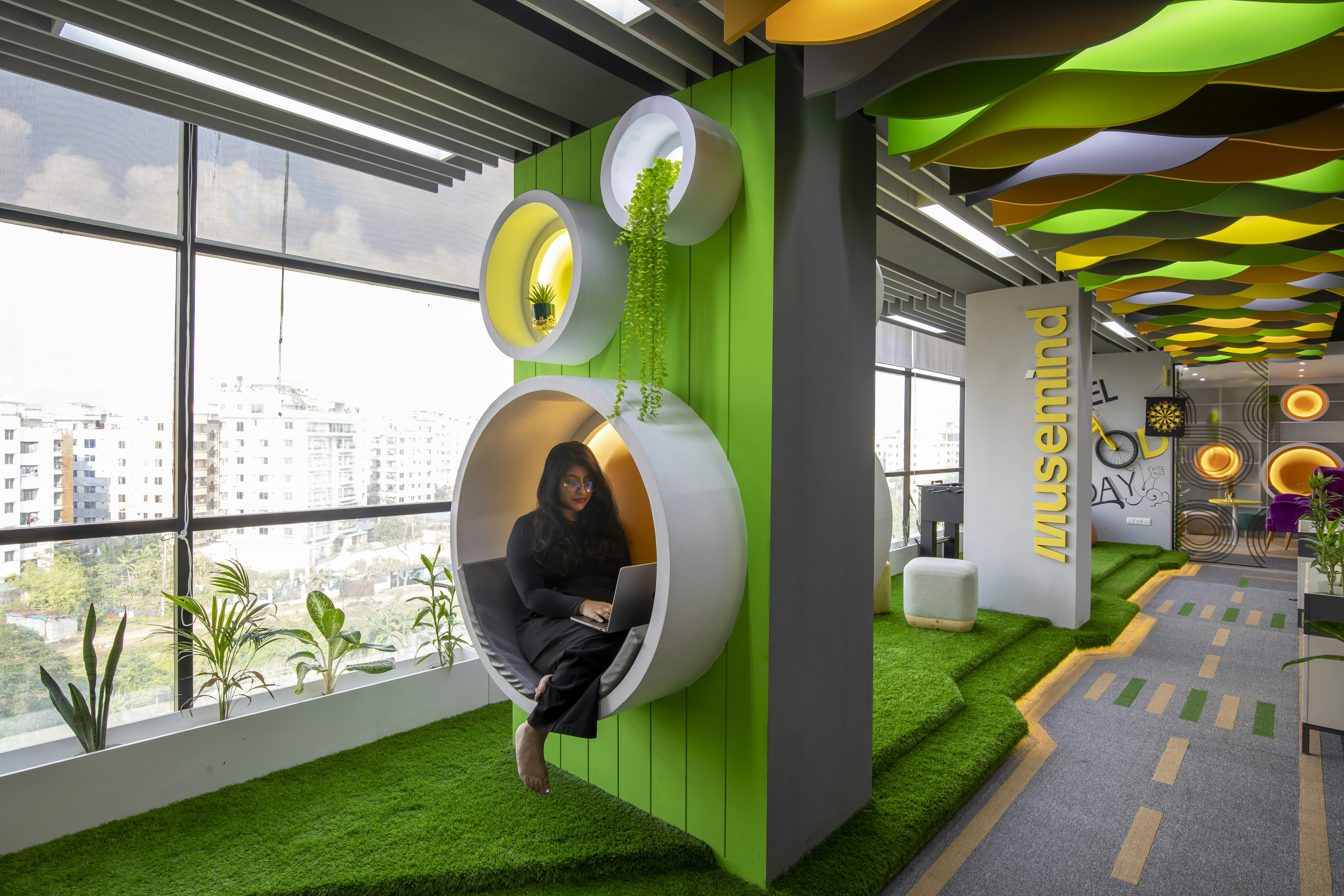 a woman is sitting in a green room