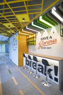 a break room with yellow and green accents
