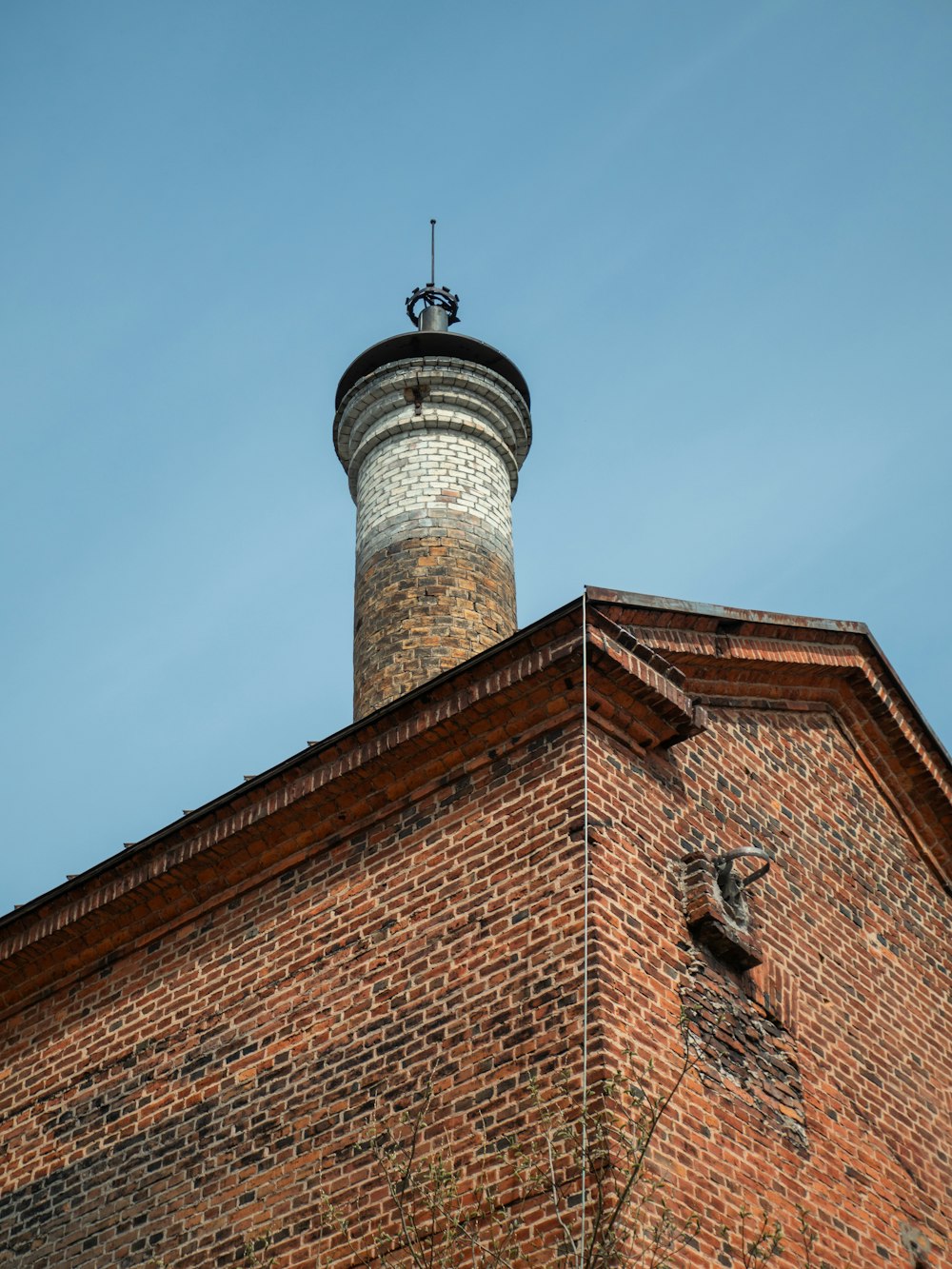 a tall brick building with a clock on top