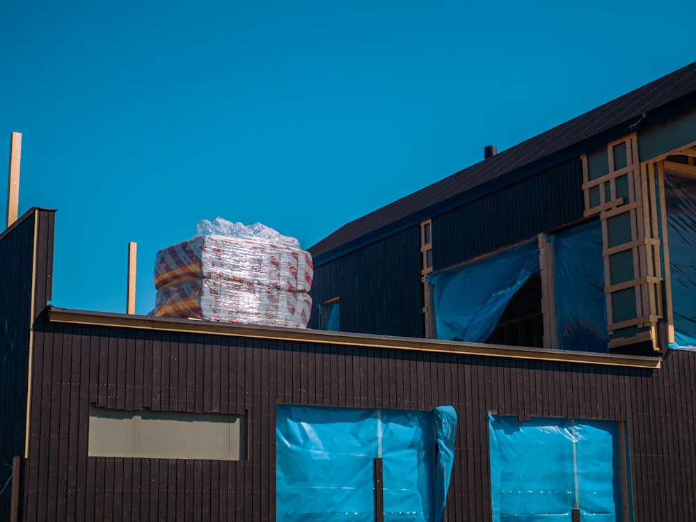 a large stack of boxes sitting on top of a building