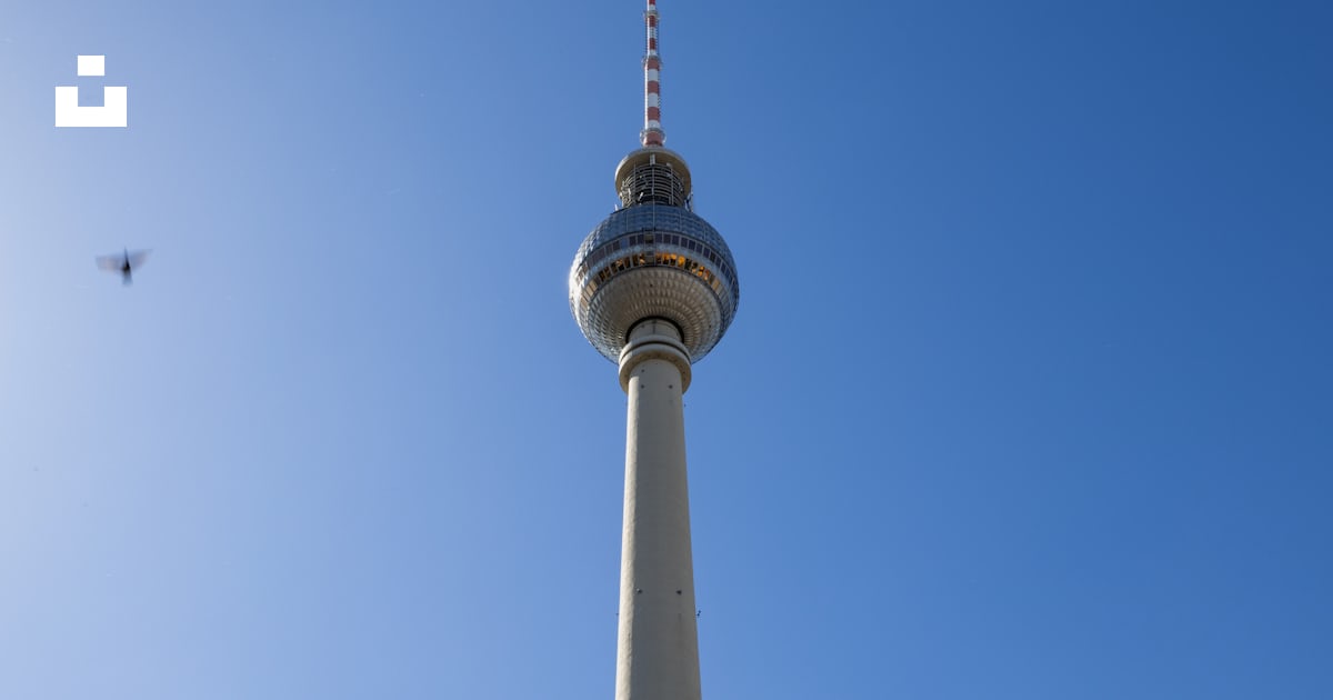 A Tall Tower With A Sky Background Photo Free Blue Image On Unsplash a-tall-tower-with-a-sky-background-photo-free-blue-image-on-unsplash