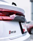 a close up of the tail lights of a white car