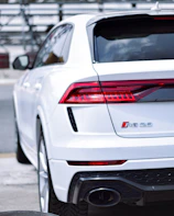 a white car parked on the side of the road