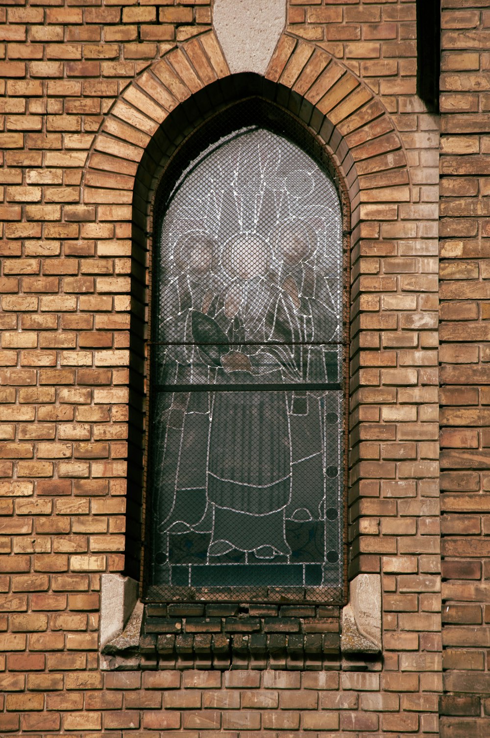 a brick building with a stained glass window