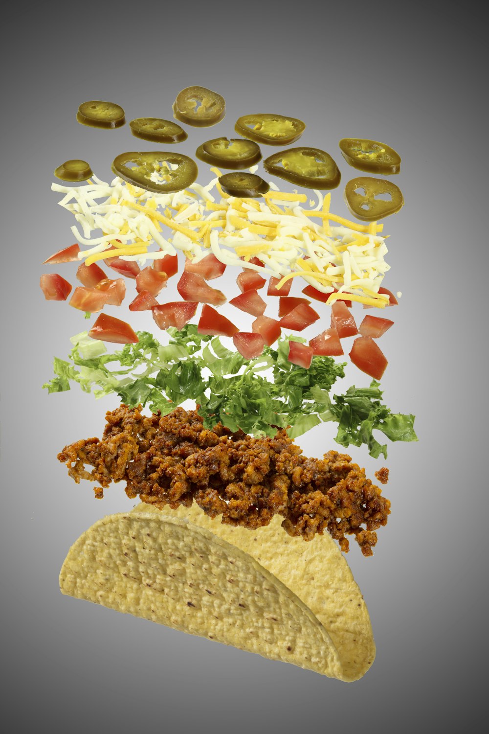a picture of a taco with toppings on it