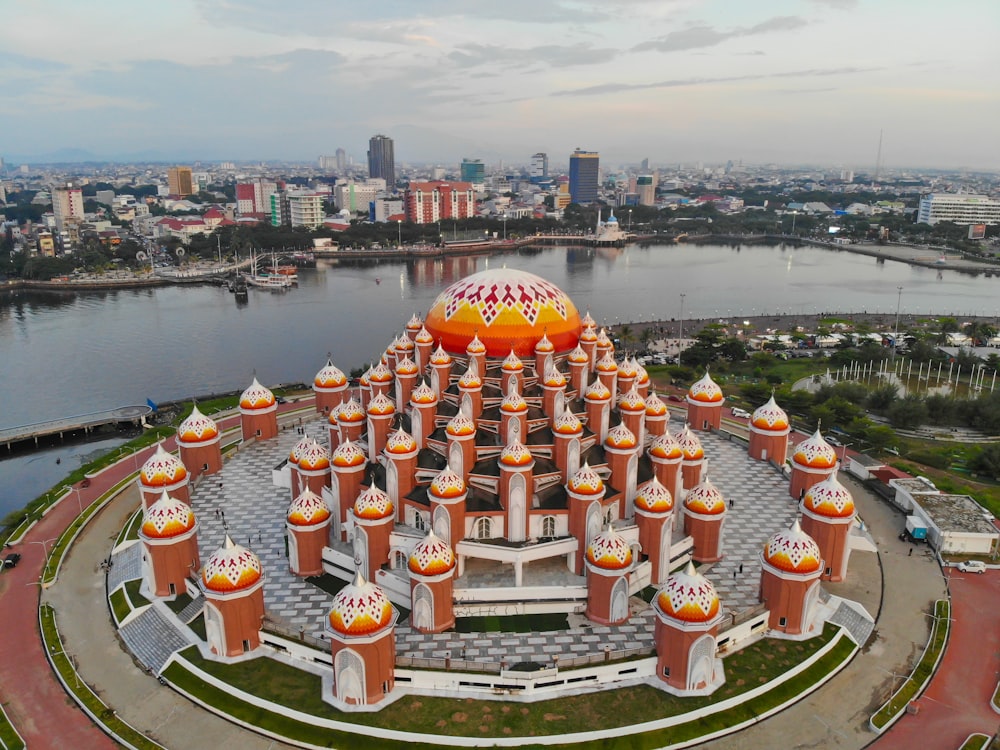 an aerial view of a building with a large orange dome