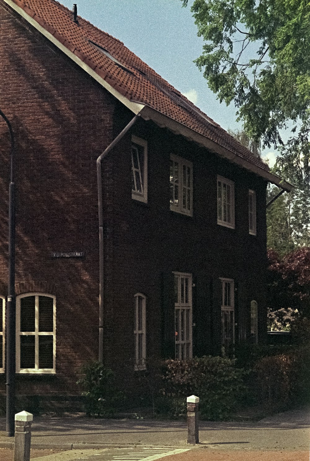 a red brick building with a clock on the front of it