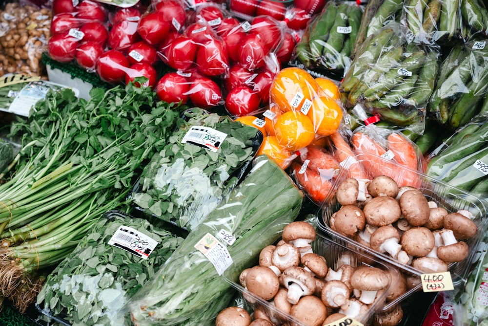 a variety of vegetables are on display at a market