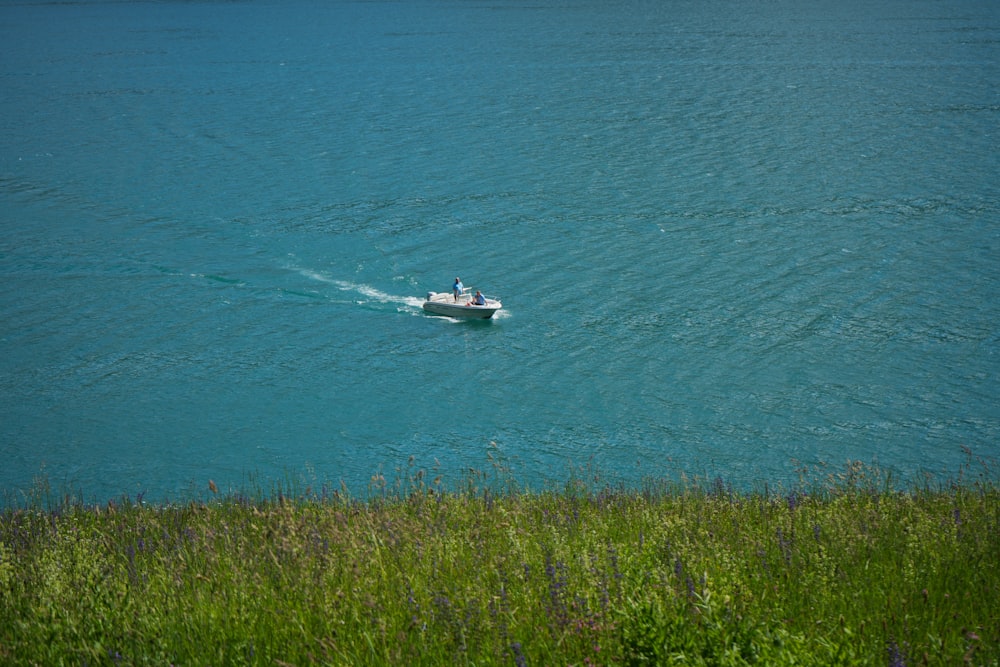 a small boat in a large body of water