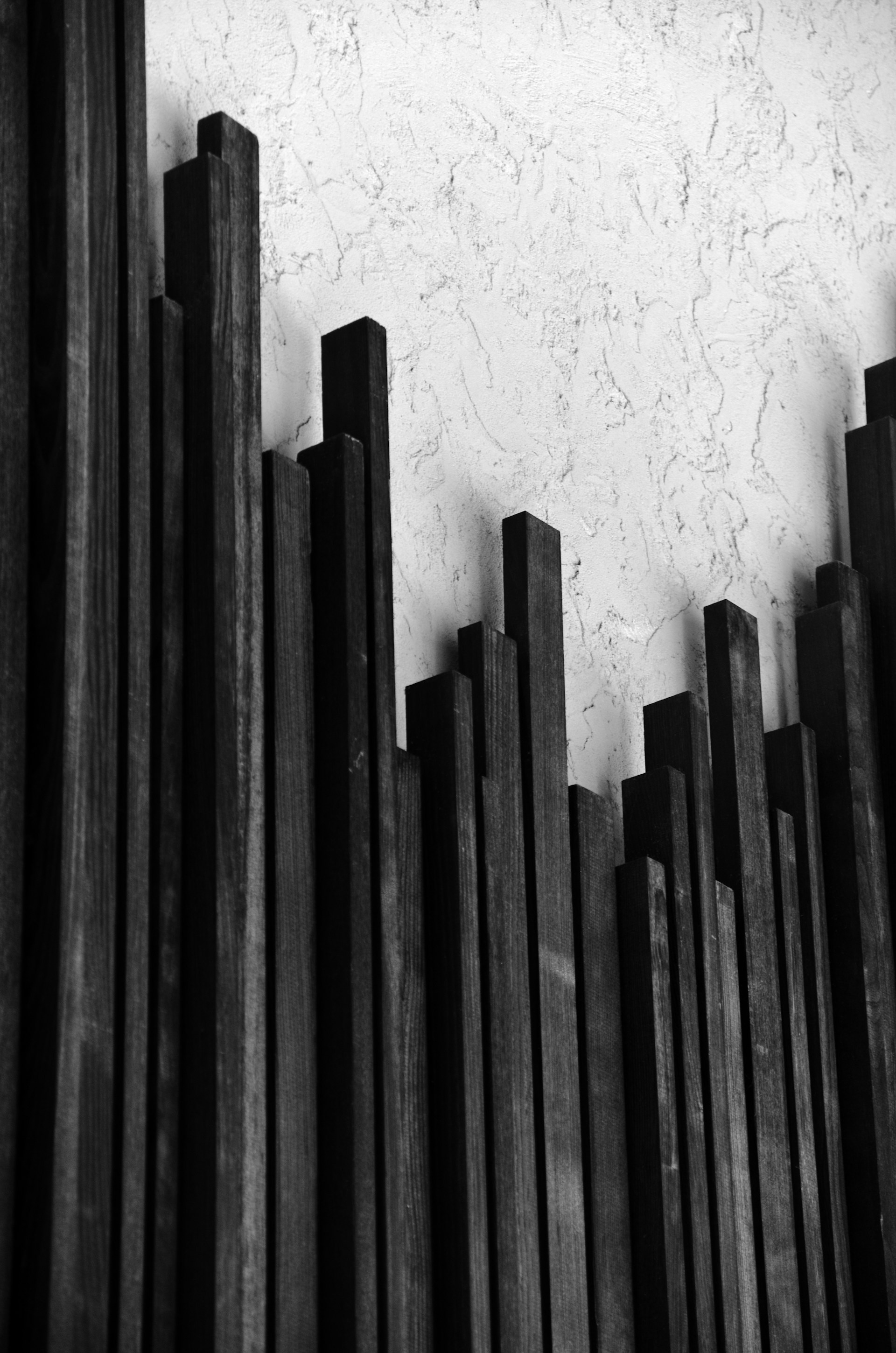 a black and white photo of a wooden fence