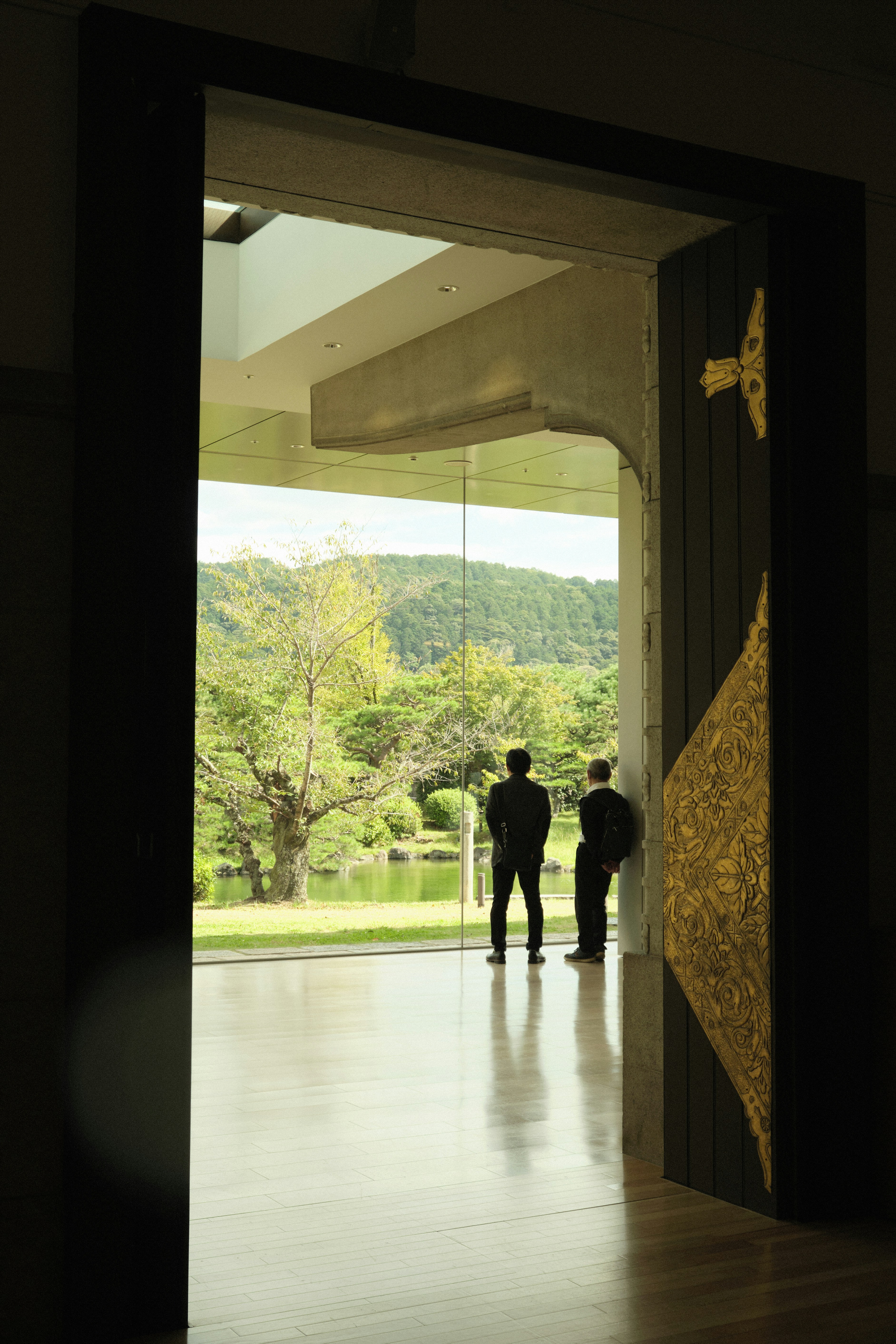 a couple of people that are standing in a doorway