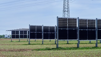 a row of solar panels in a field