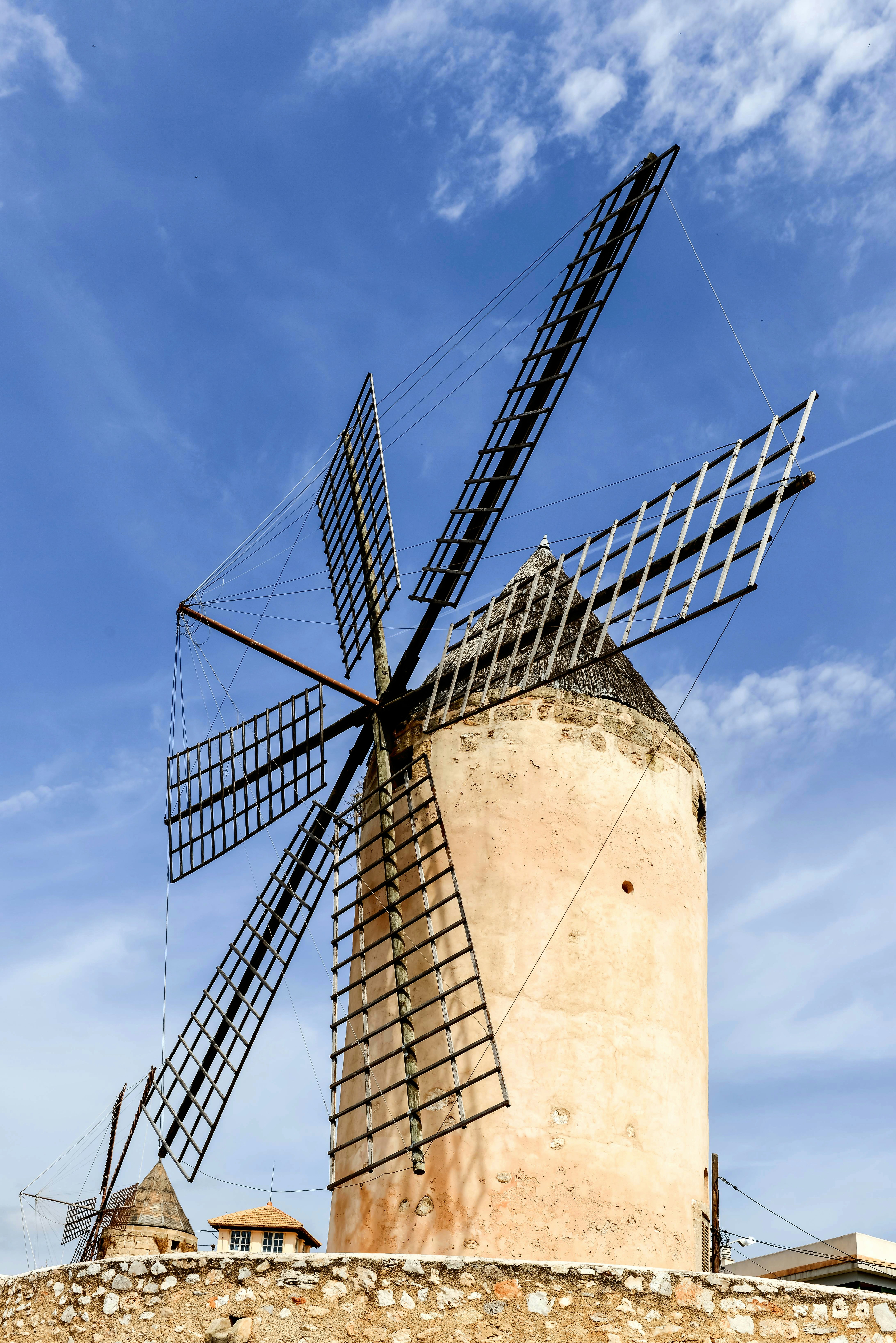 a large windmill sitting on top of a hill