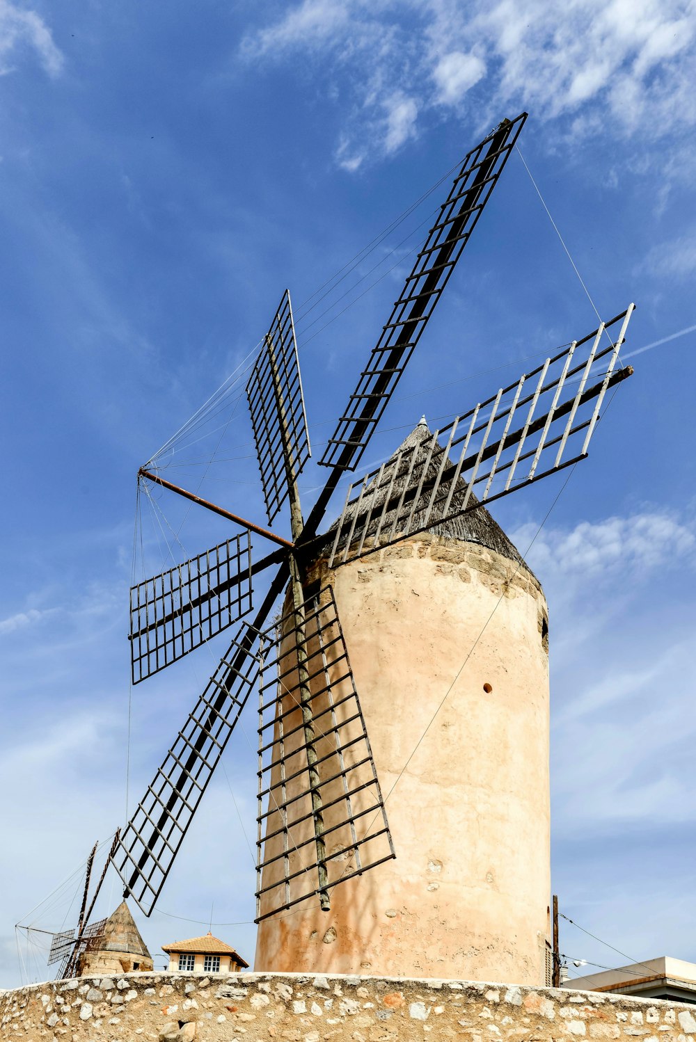 a large windmill sitting on top of a hill