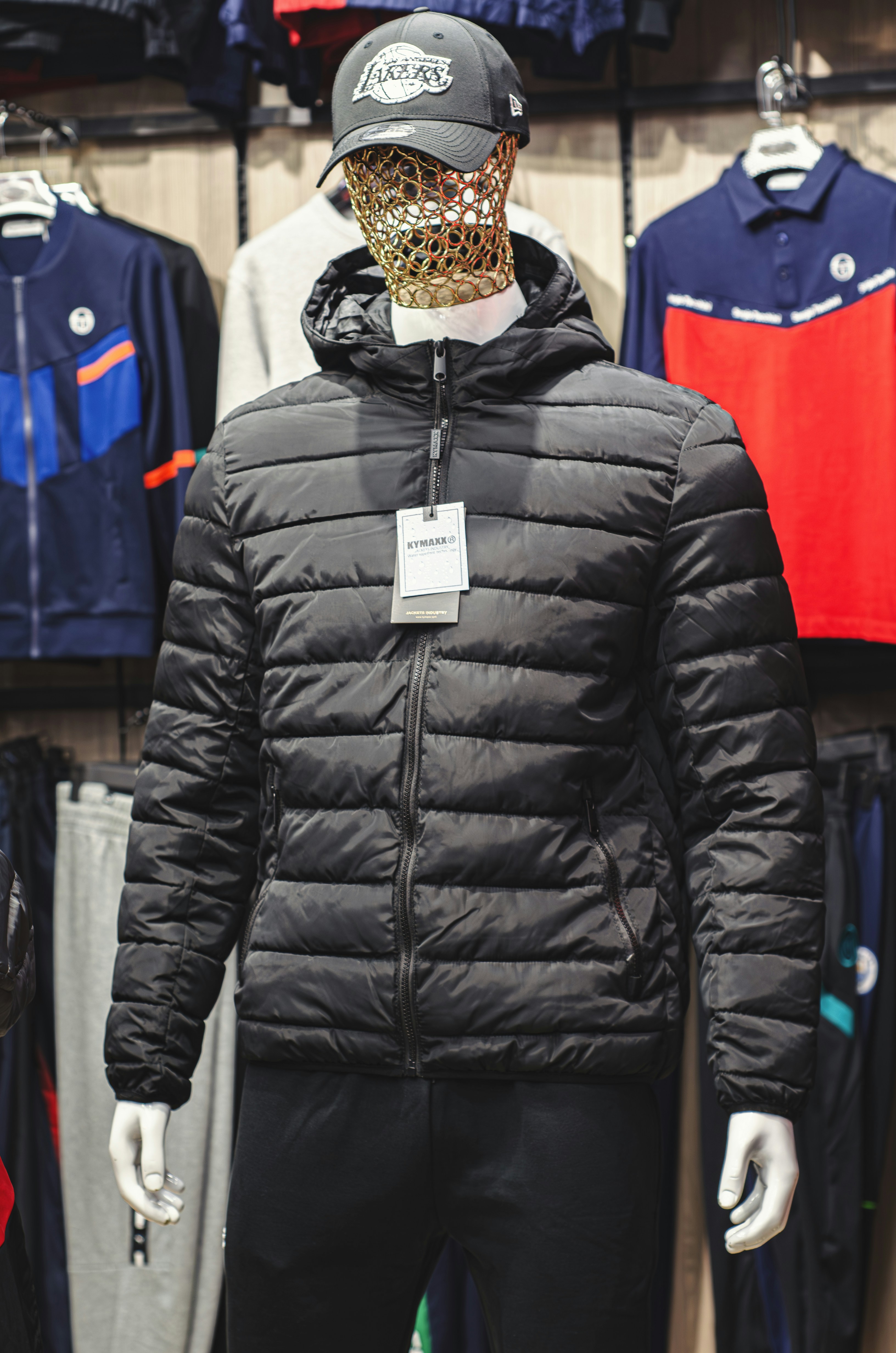 a mannequin wearing a black jacket and hat