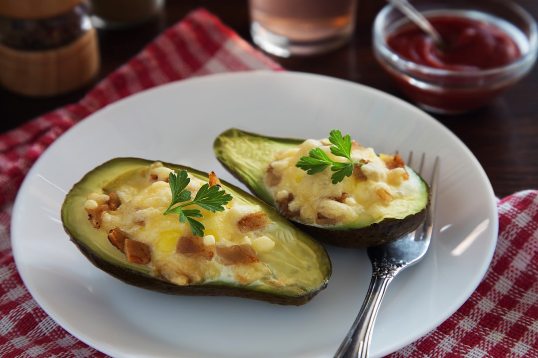 Baked avocado with cheese, parsley and bacon