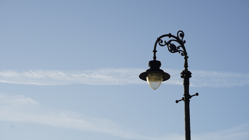 a street light with a clear blue sky in the background