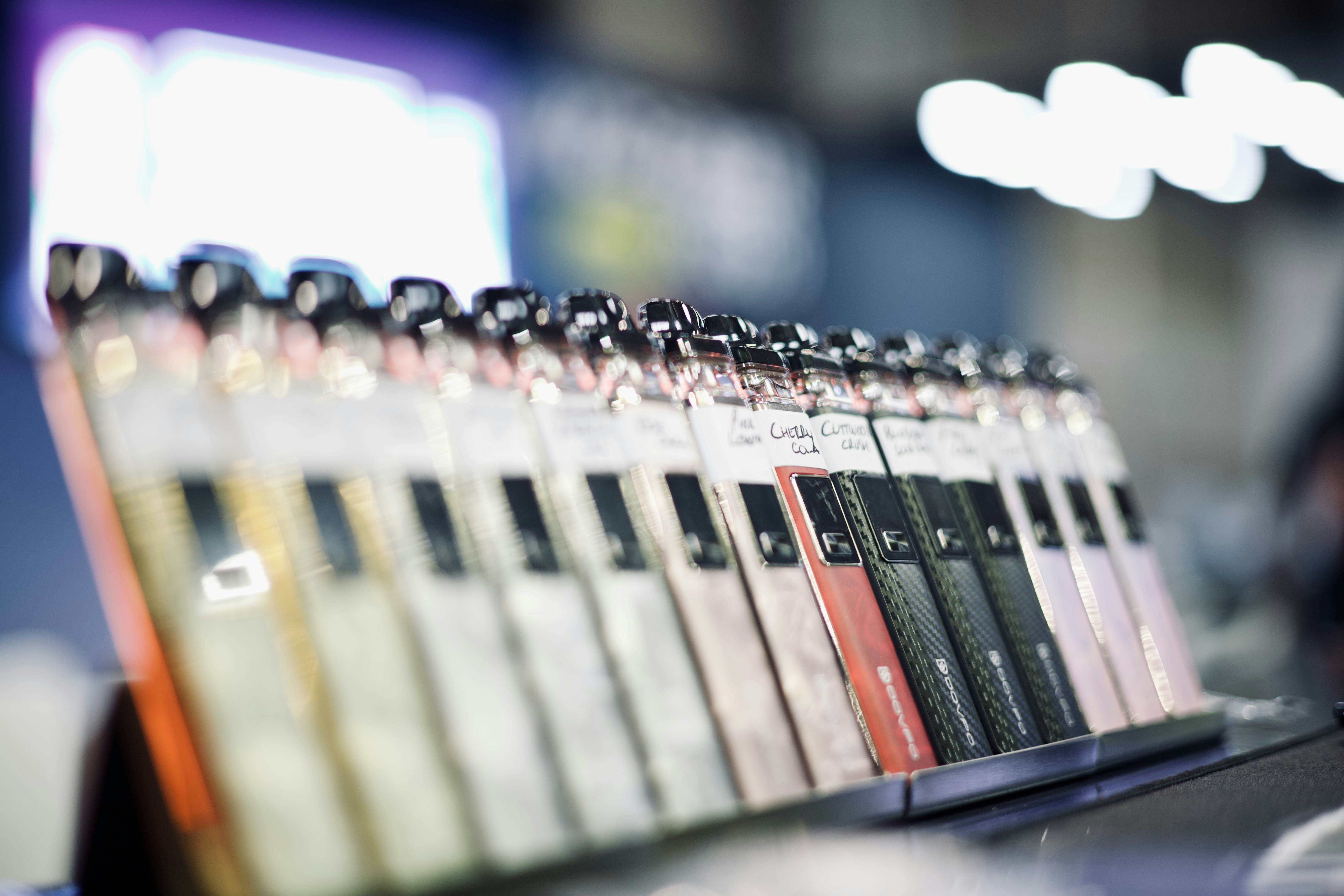a row of pens sitting on top of a table