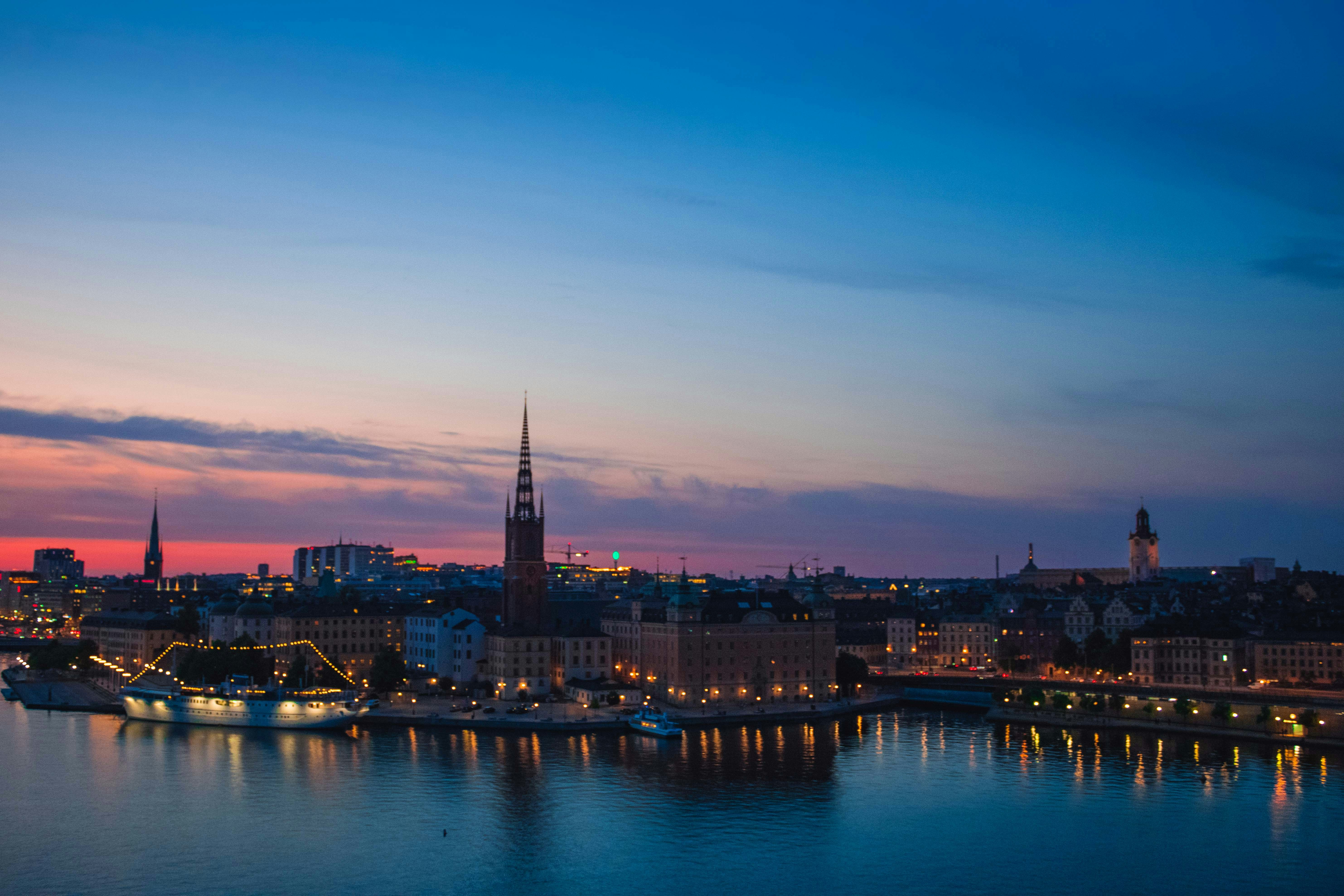 a view of a city at night from across the water