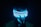 a man wearing a neon mask in the dark