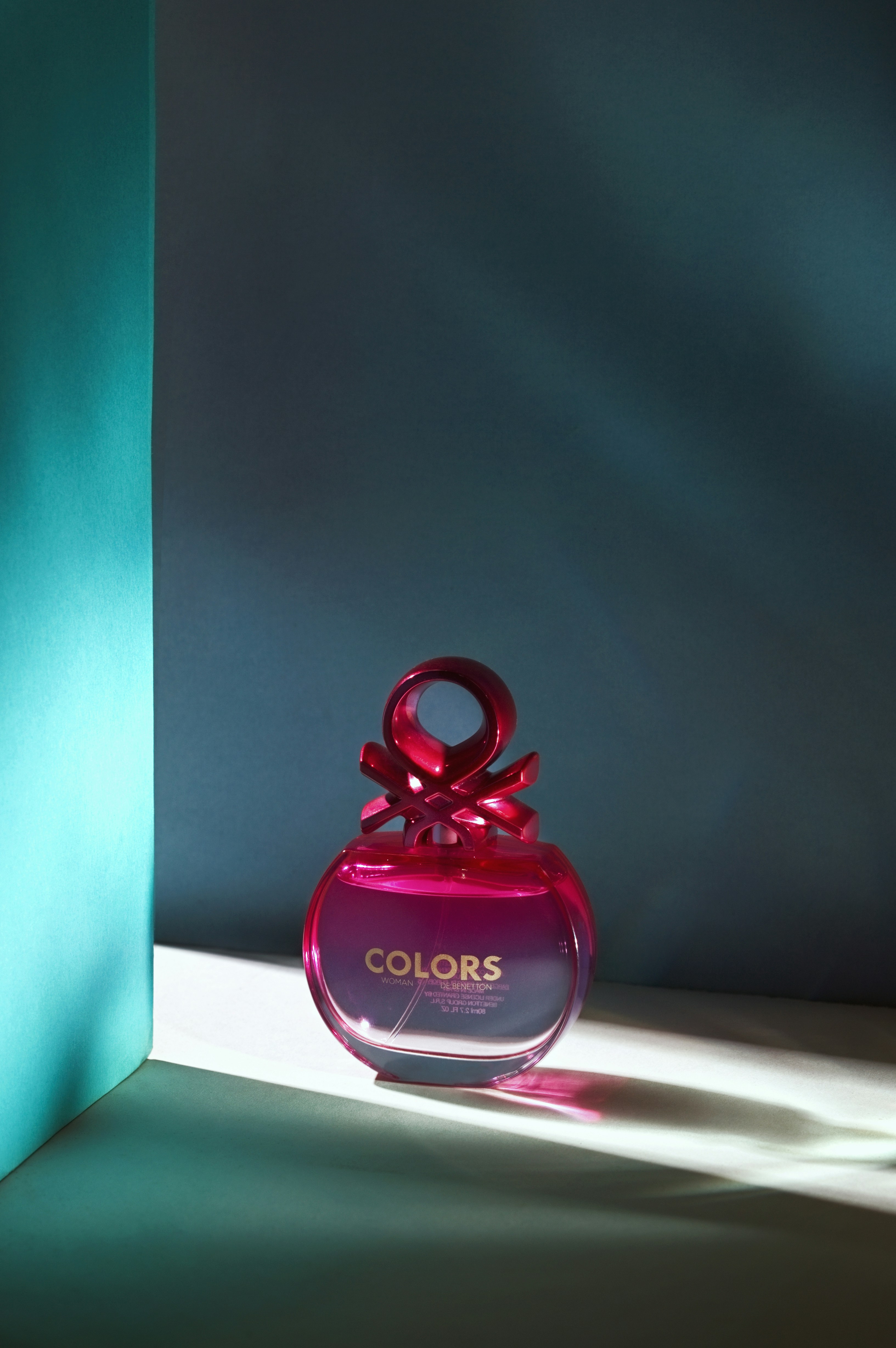 a bottle of perfume sitting on top of a table