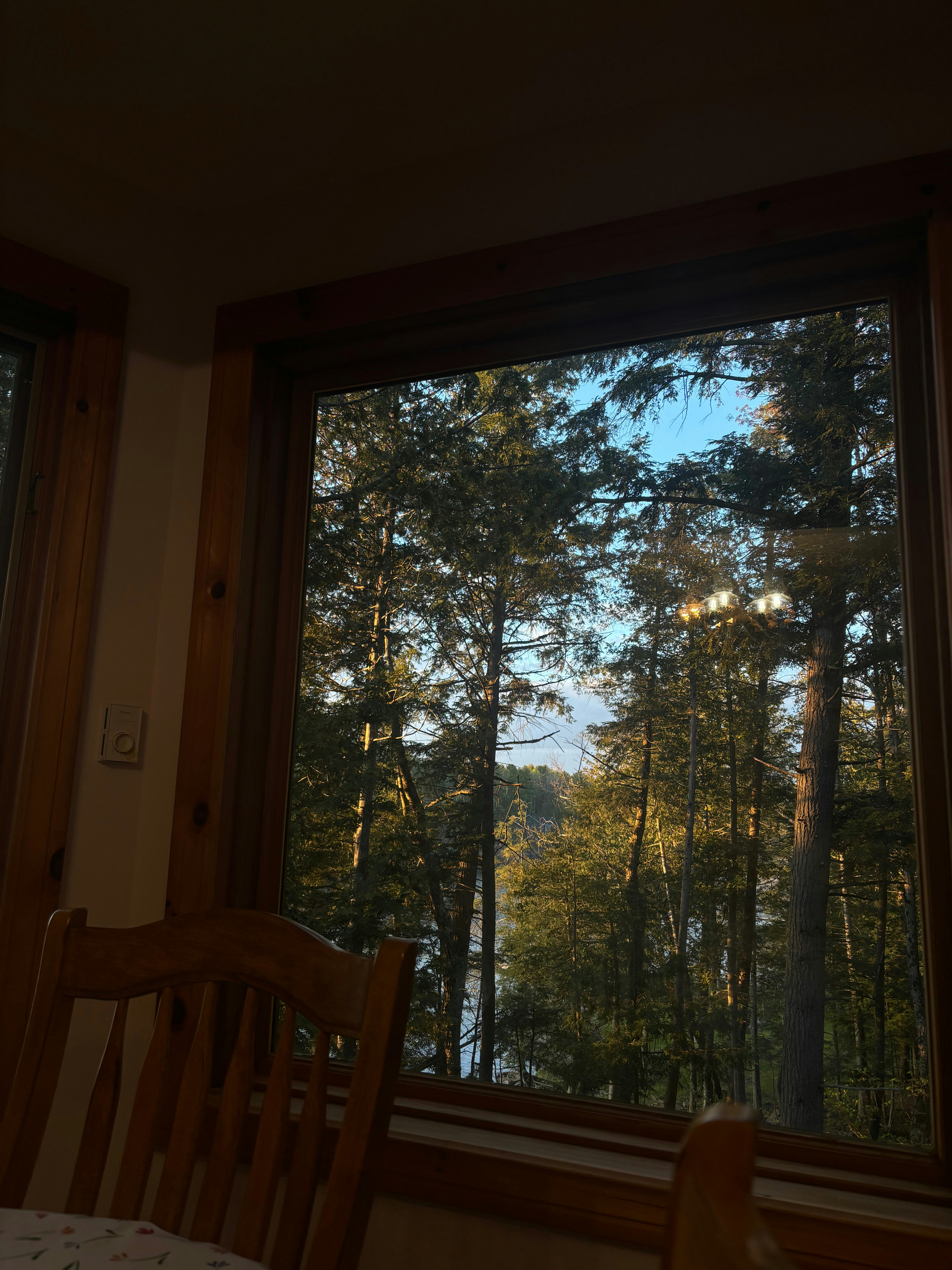 a chair sitting in front of a large window