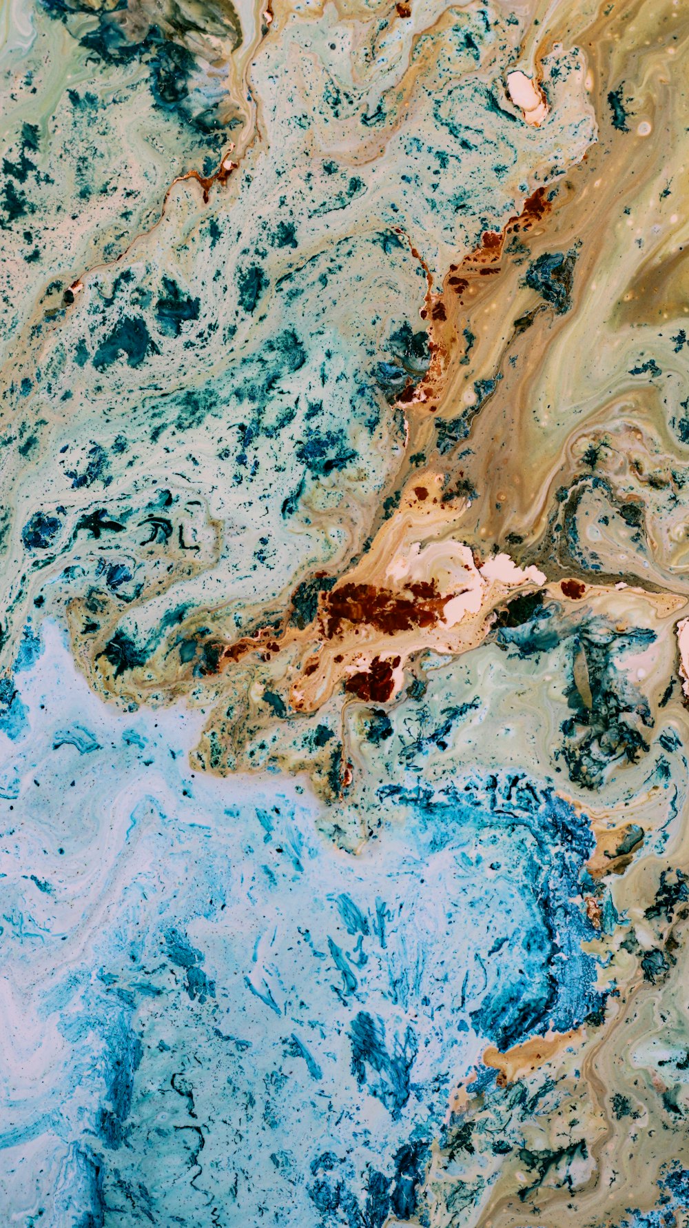 a close up of a blue and brown marble