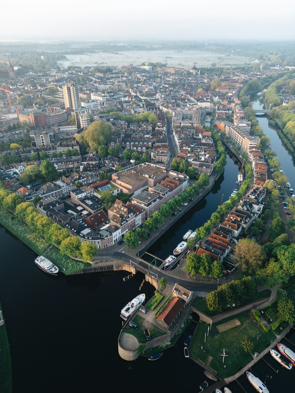 an aerial view of a river and a city