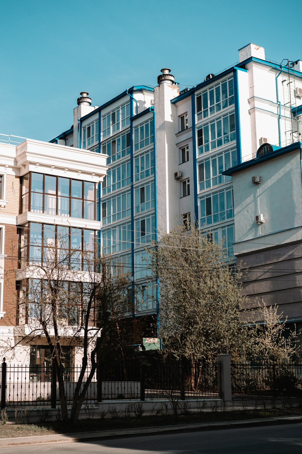 a row of buildings on the side of a street