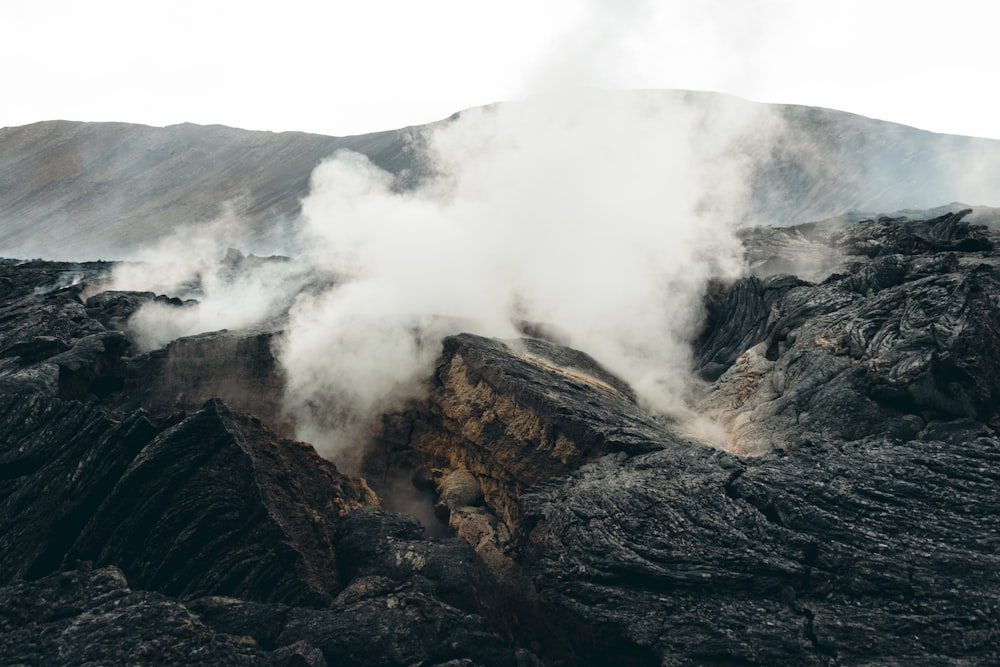 steam rises from the top of a mountain