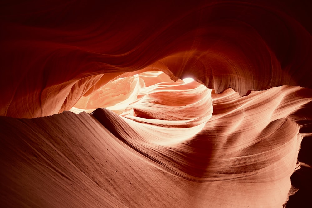 the light shines through a crack in the rock