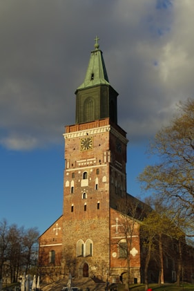 a tall tower with a clock on the top of it