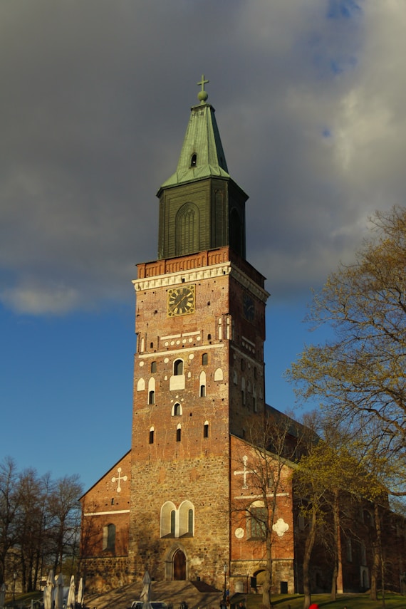 a tall tower with a clock on the top of it