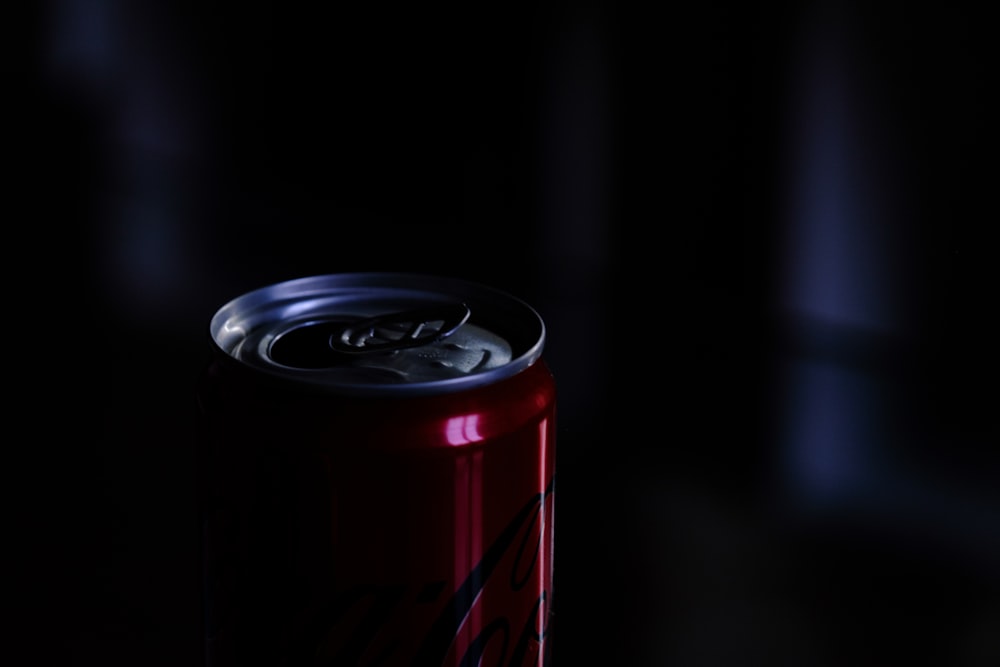 a can of soda sitting in the dark