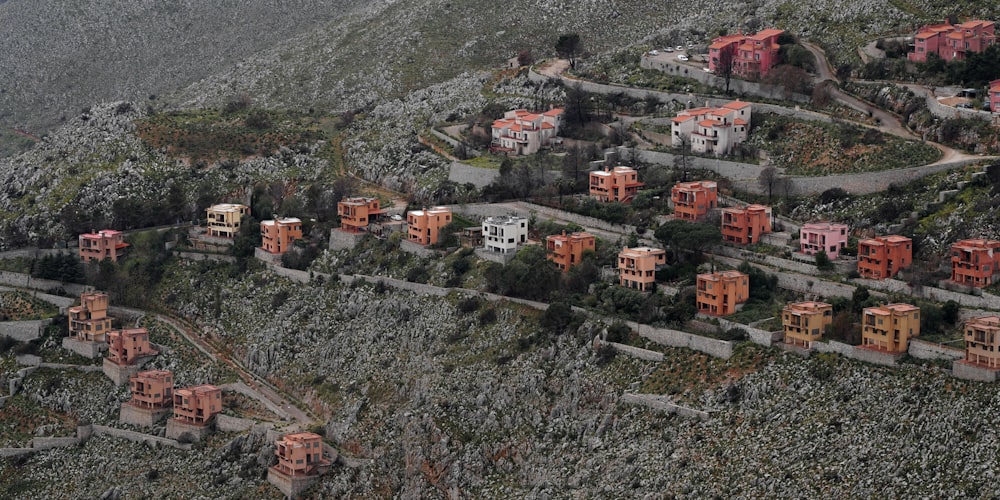 an aerial view of a small village in the mountains