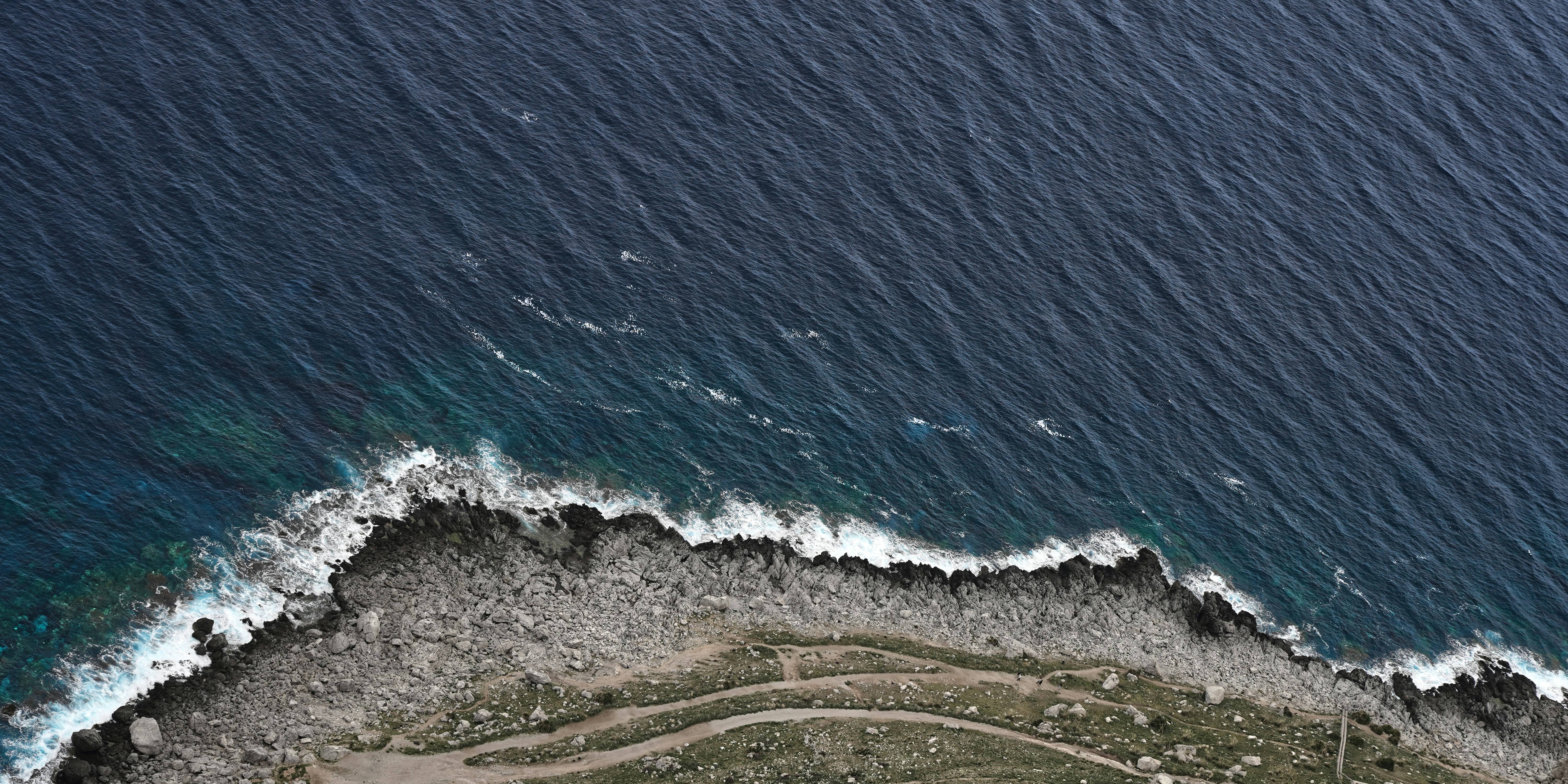 a bird's eye view of a beach and ocean