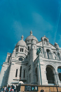 a large white building with a statue on top of it