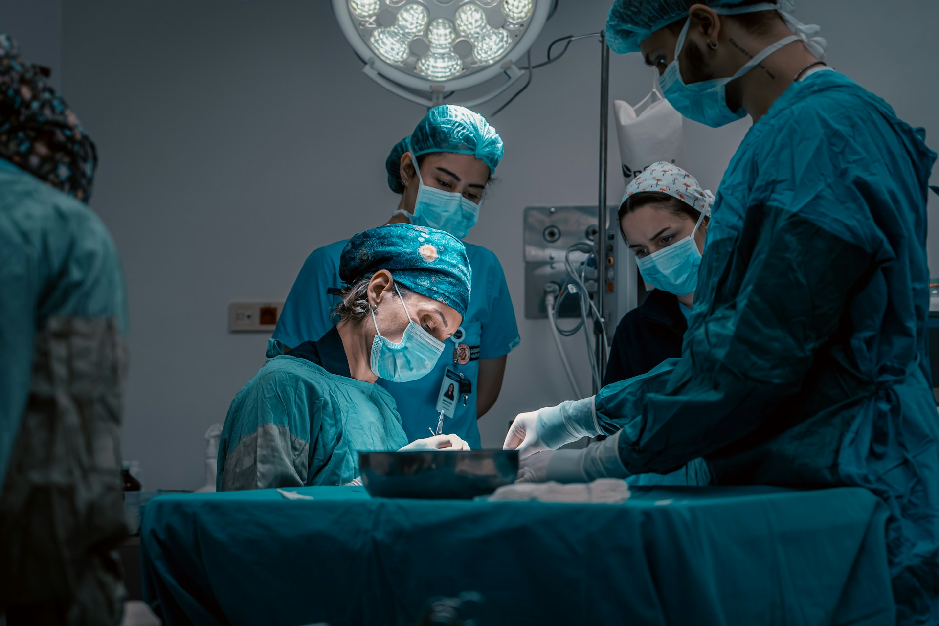 a group of doctors performing surgery on a patient