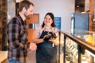 a man standing next to a woman in a store