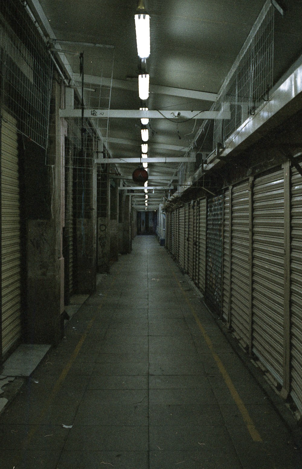 a long hallway with lots of storage doors