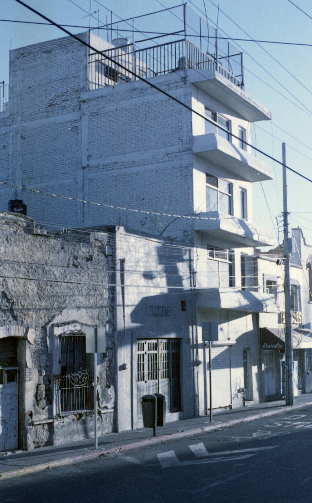 a white building with a clock on the side of it