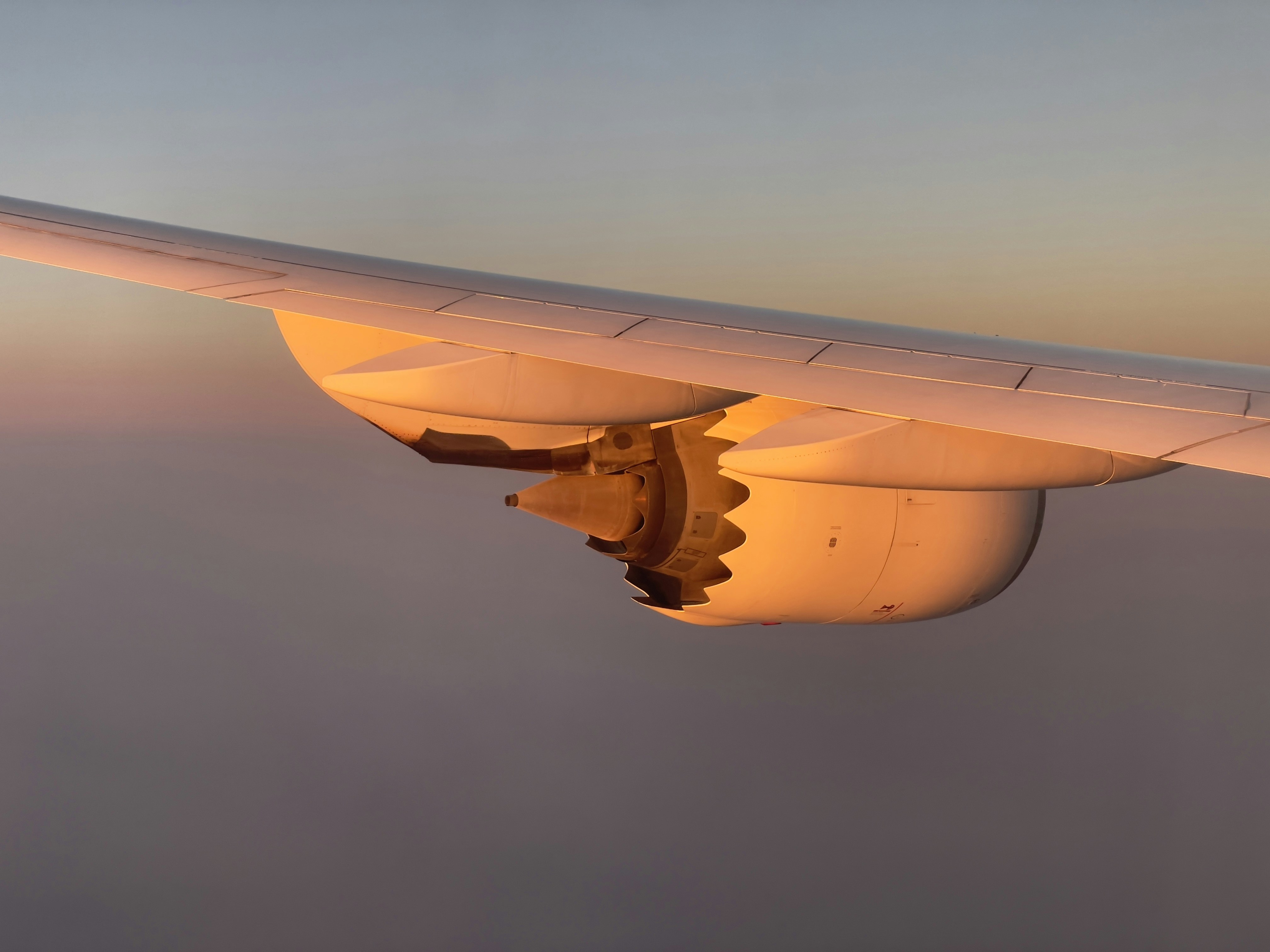 a view of the wing of an airplane in the sky, 