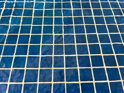 a close up of a blue and white tiled floor