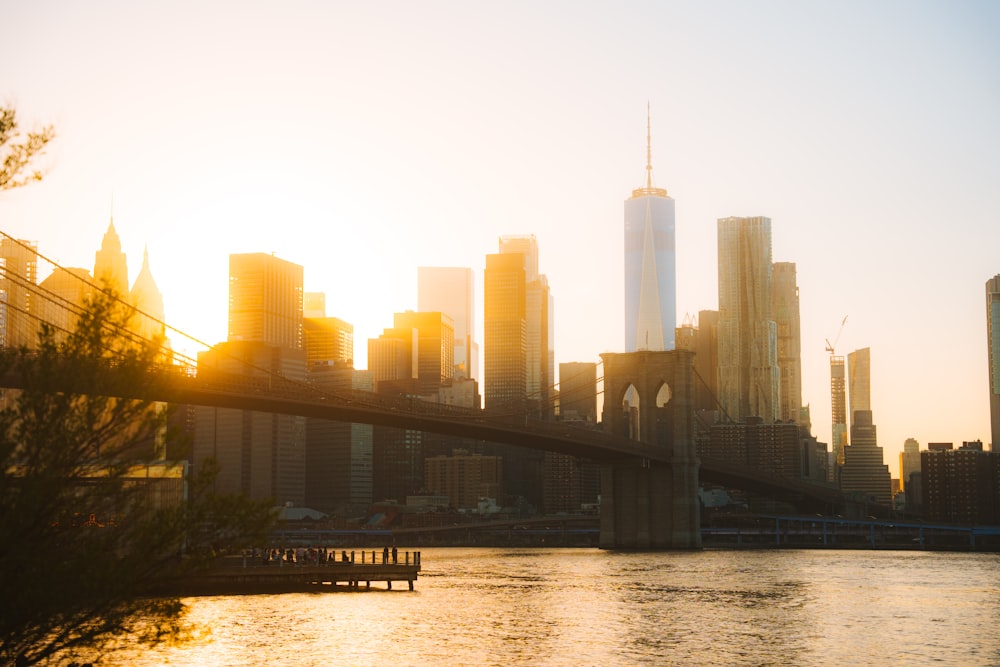 the sun is setting over the city skyline