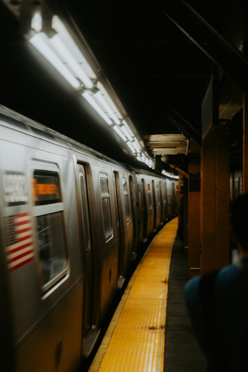 a subway train pulling into a train station