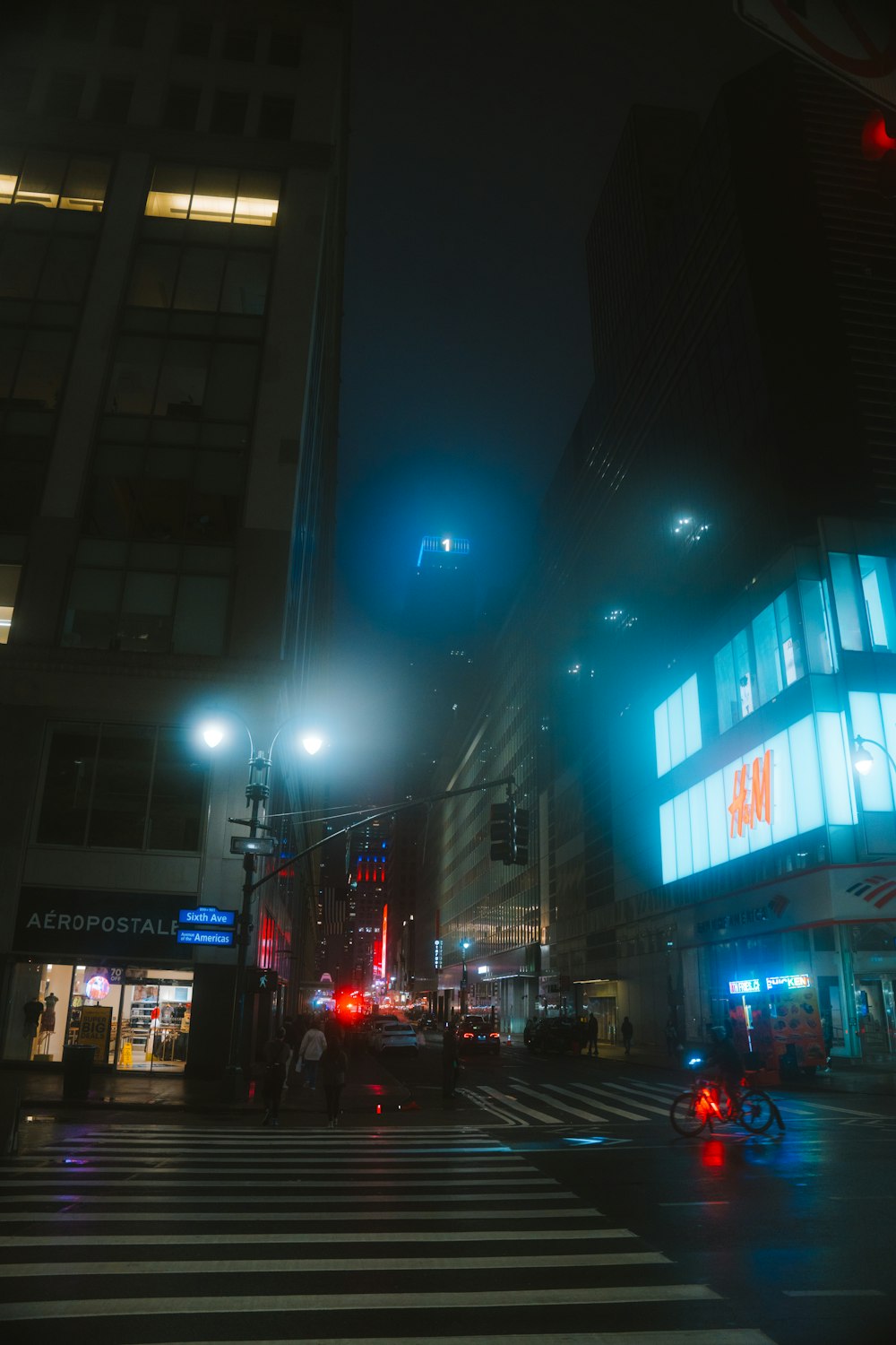 a city street at night with traffic lights